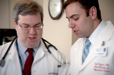 Dr. Negoianu and Dr. Goldberg discussing a case